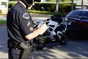 a cop writing a traffic ticket